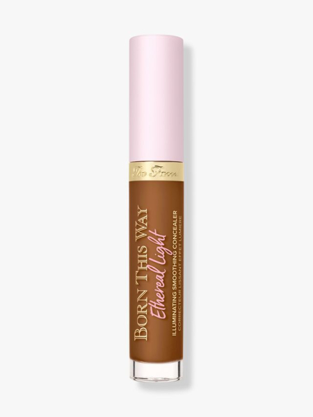Too Faced Born This Way Ethereal Light Illuminating Smoothing Concealer vial of concealer with a light pink cap on light gray background